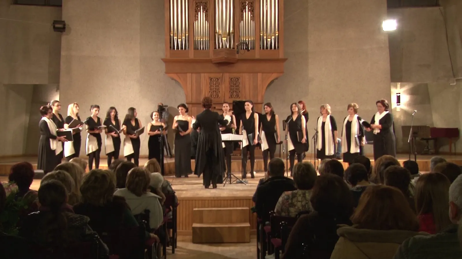 Yerevan Voices performing before a full hall in Yerevan
